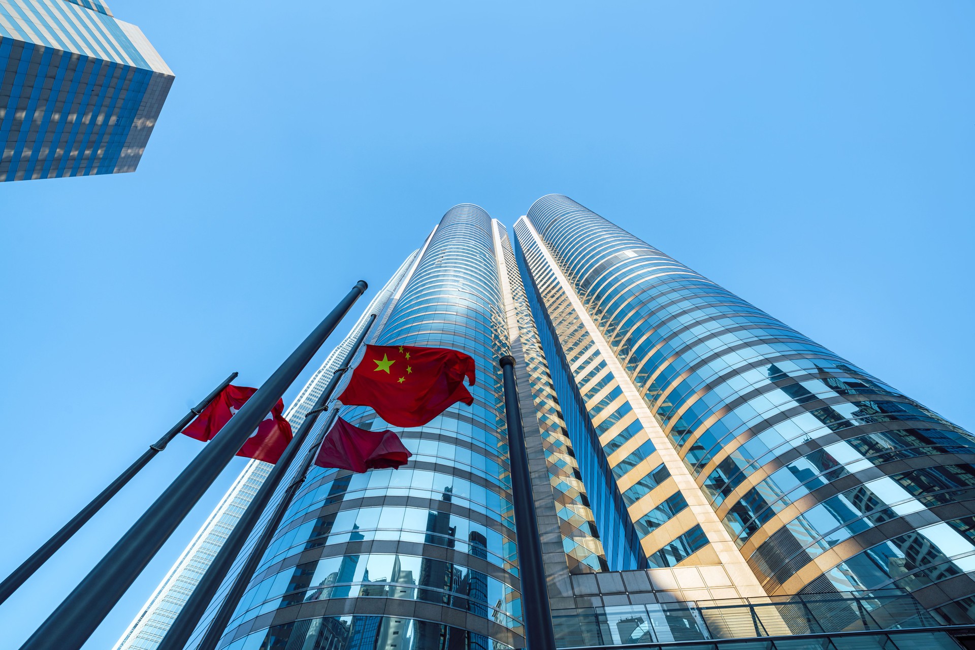 Modern Skyscrapers and Flags in Downtown Hong Kong